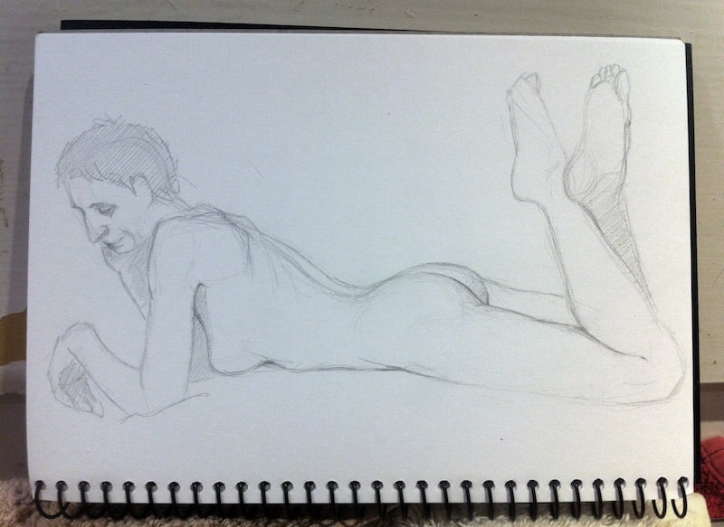 'Girl lying on stomach' in graphite pencil