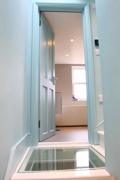 Glass staircase landing by Simply Loft