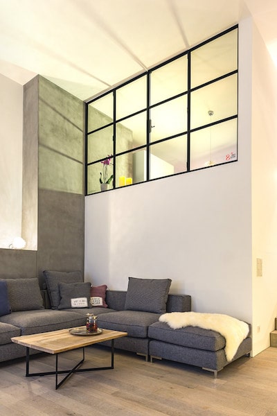 High window between bathroom and living space